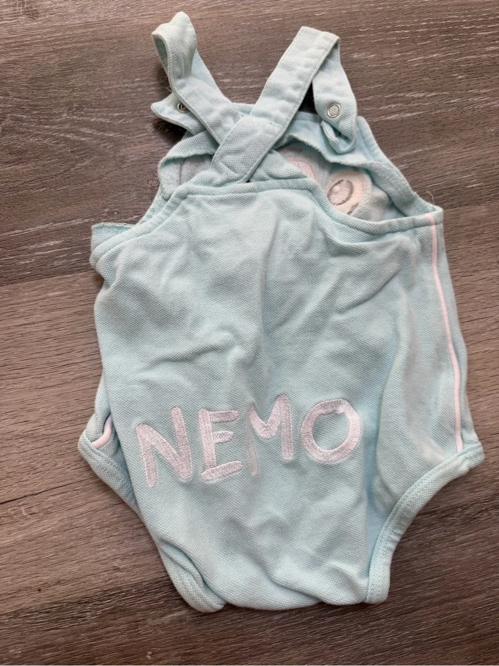 Nemo light blue one piece with “nemo” on the back. Y2K Vintage.